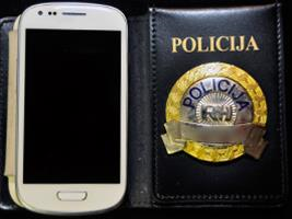 Slika PU_BP/Mobitel i značka policija.png